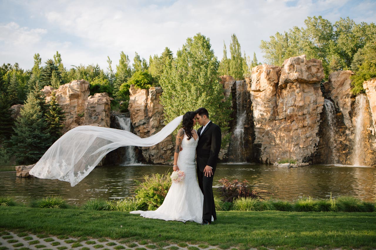 Couple in front of Thanksgving Point waterfall.